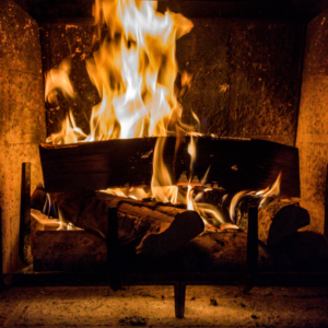 close up of wood burning in a fireplace