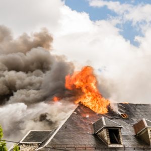 a roof on fire with lots of smoke