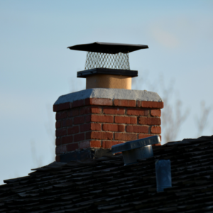 masonry chimney with concrete crown and chimney cap