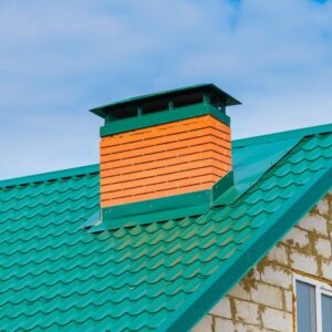 green outside mountain chimney cap that matches green roof